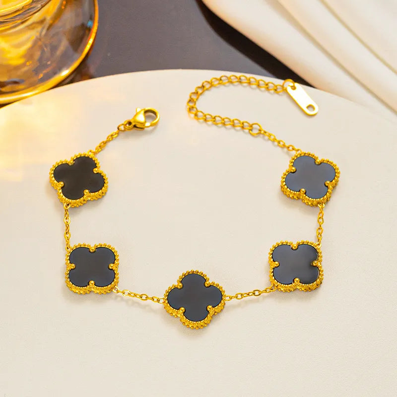 PULSERA VAN CLEEF TREBOLES NEGRO DORADO