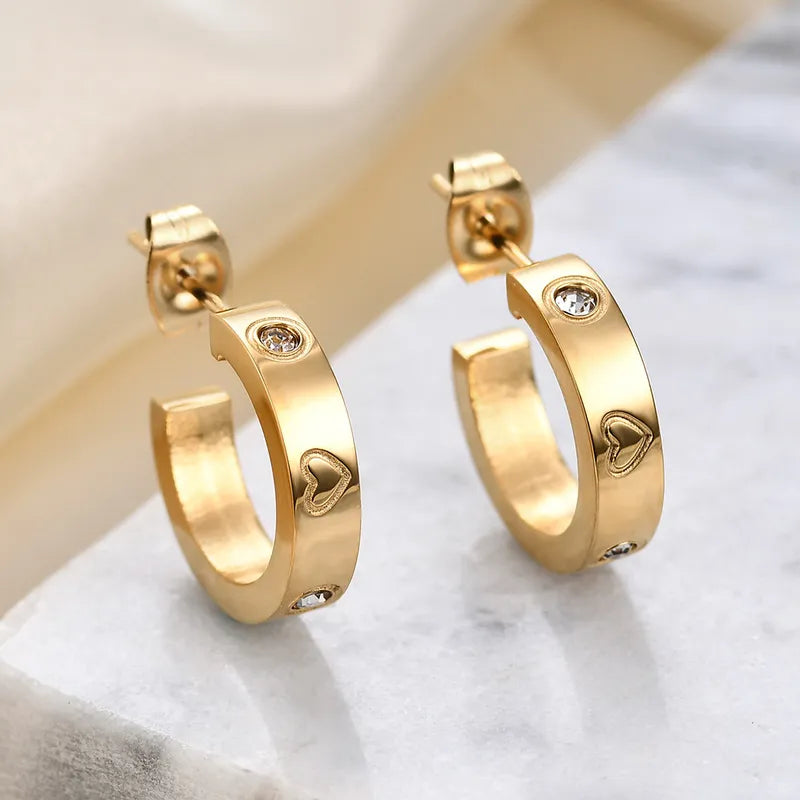 Aretes argollas con zircones corazones dorado