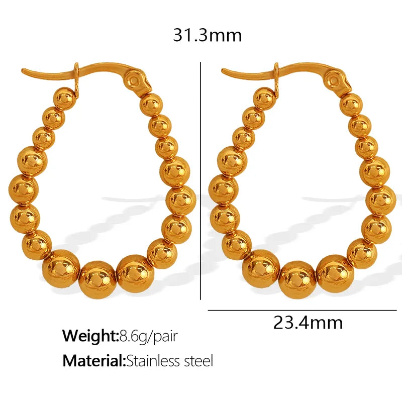 Aretes balines dorado ovalo