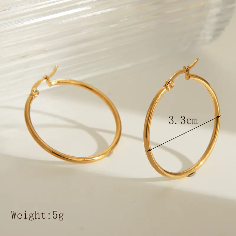 Aretes argollas basicas de 3.3 cm dorado