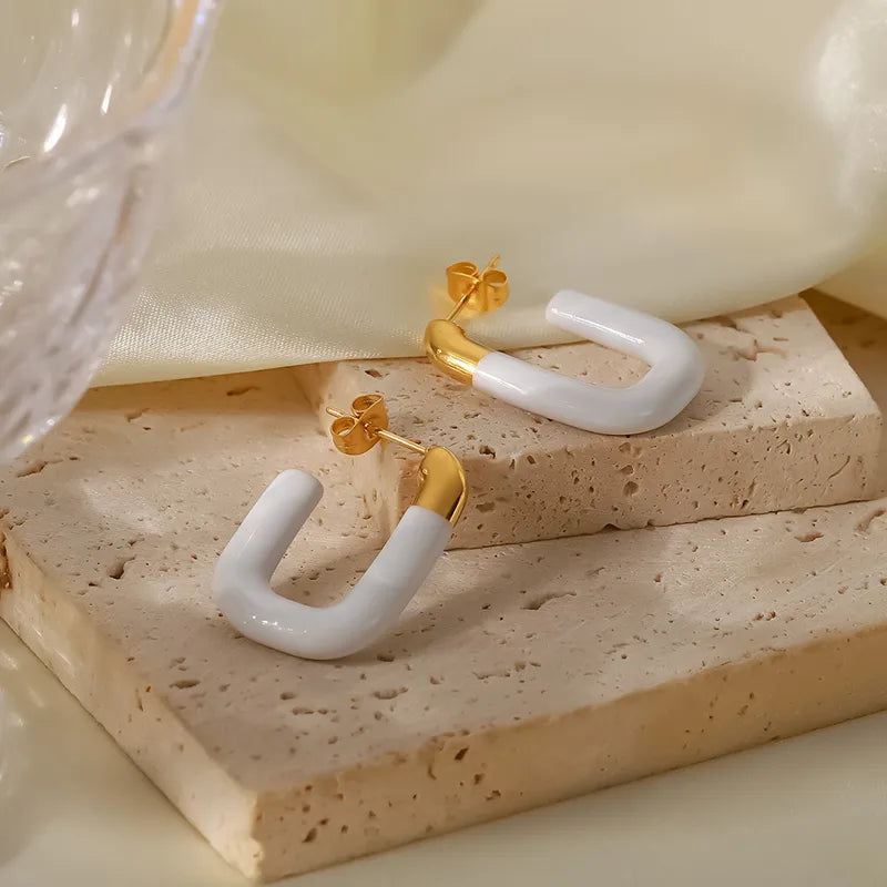 ARETES OVALADOS BLANCOS