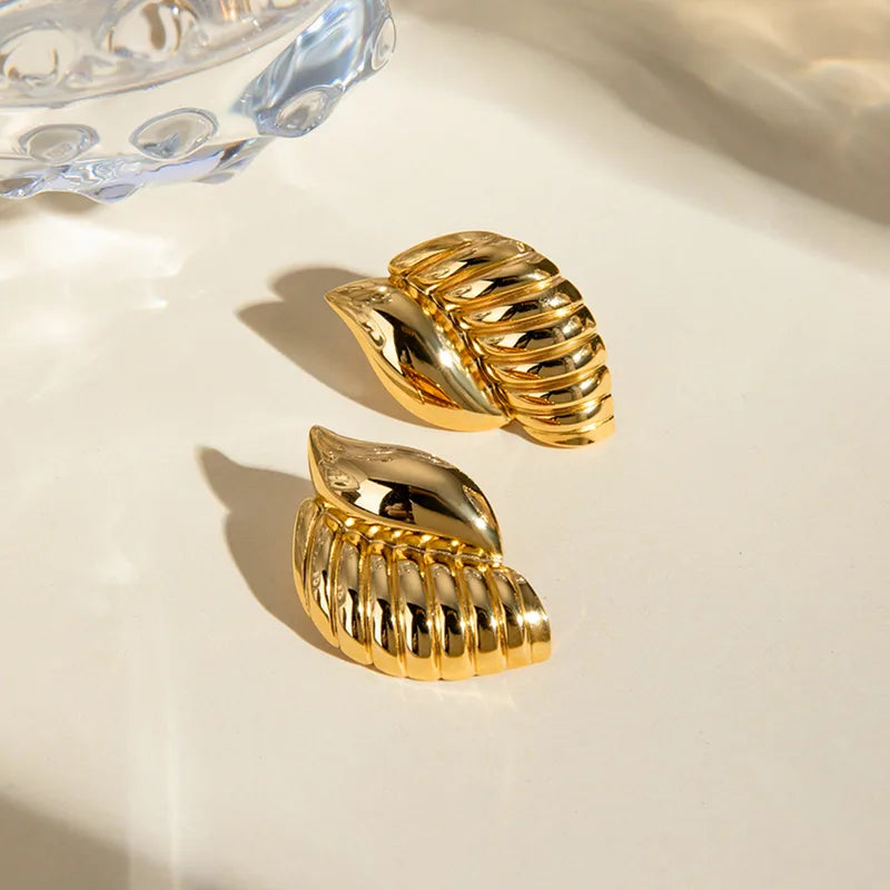 ARETES CARACOL TEXTURA DORADO
