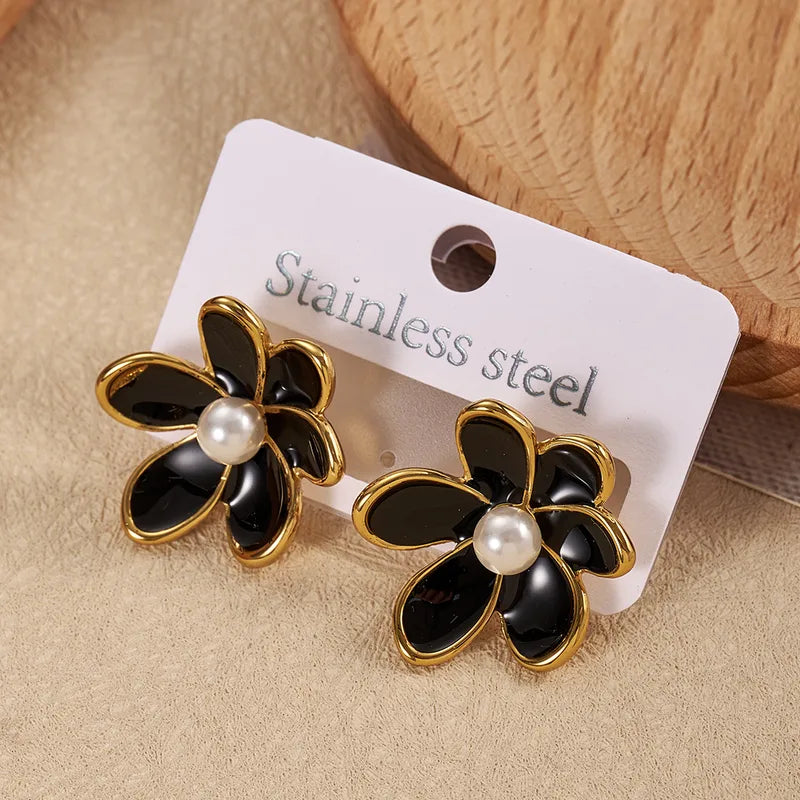 ARETES DE FLOR NEGRA DORADO