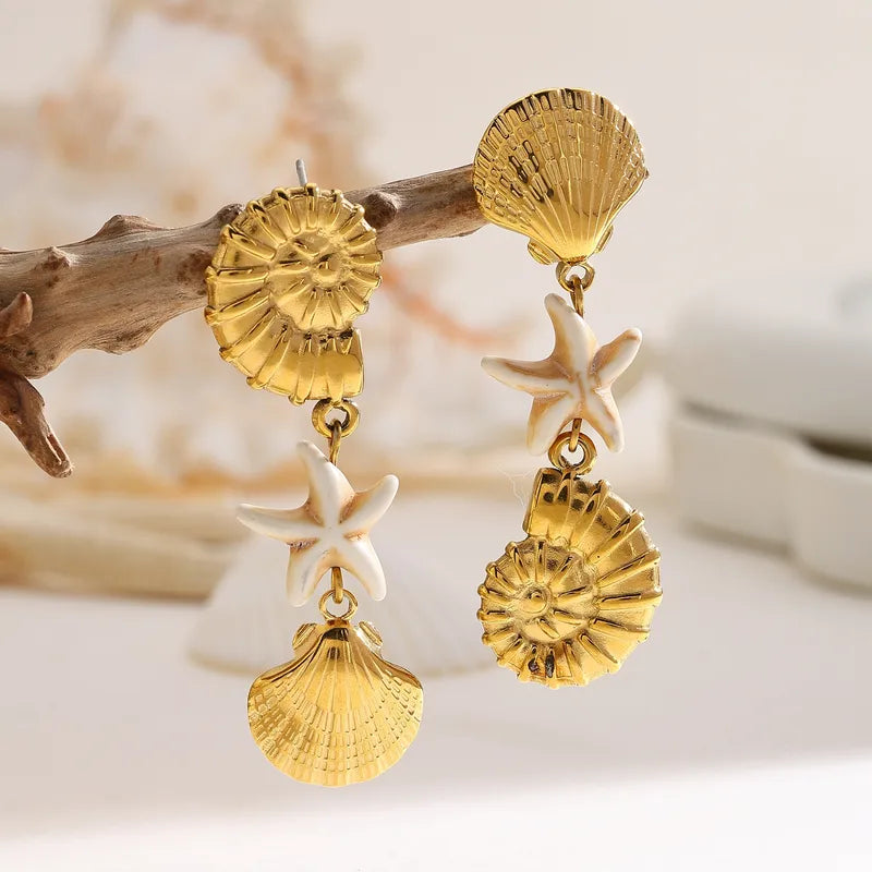 ARETES DE CONCHAS DORADO