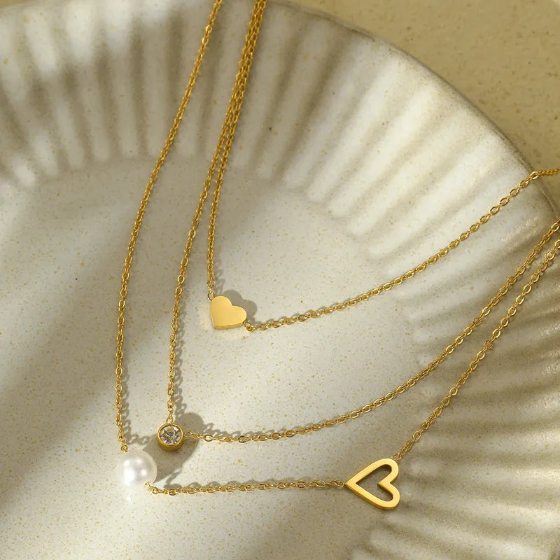 LAYER TRIPLE CORAZONES PERLA DORADO