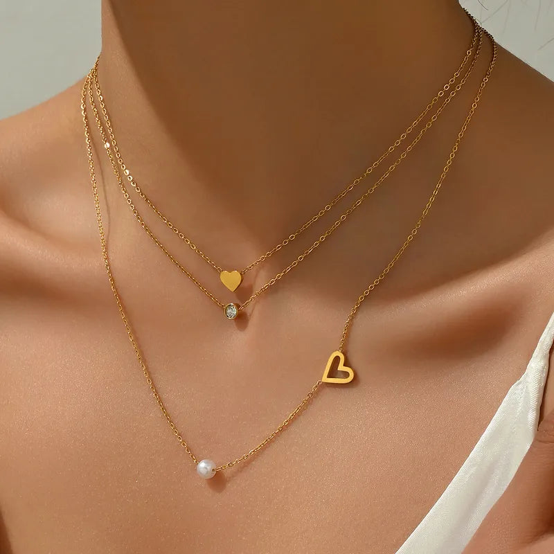 LAYER TRIPLE CORAZONES PERLA DORADO