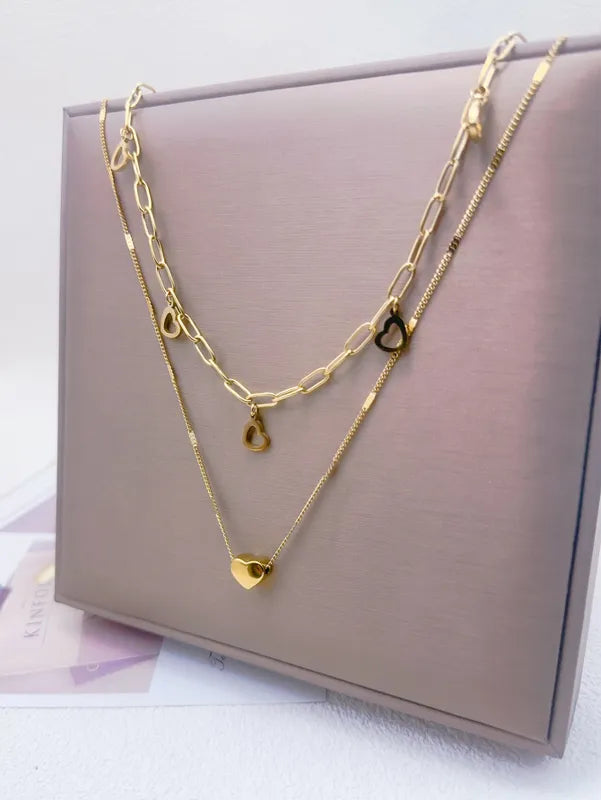 Layer doble corazon con eslabones dorado