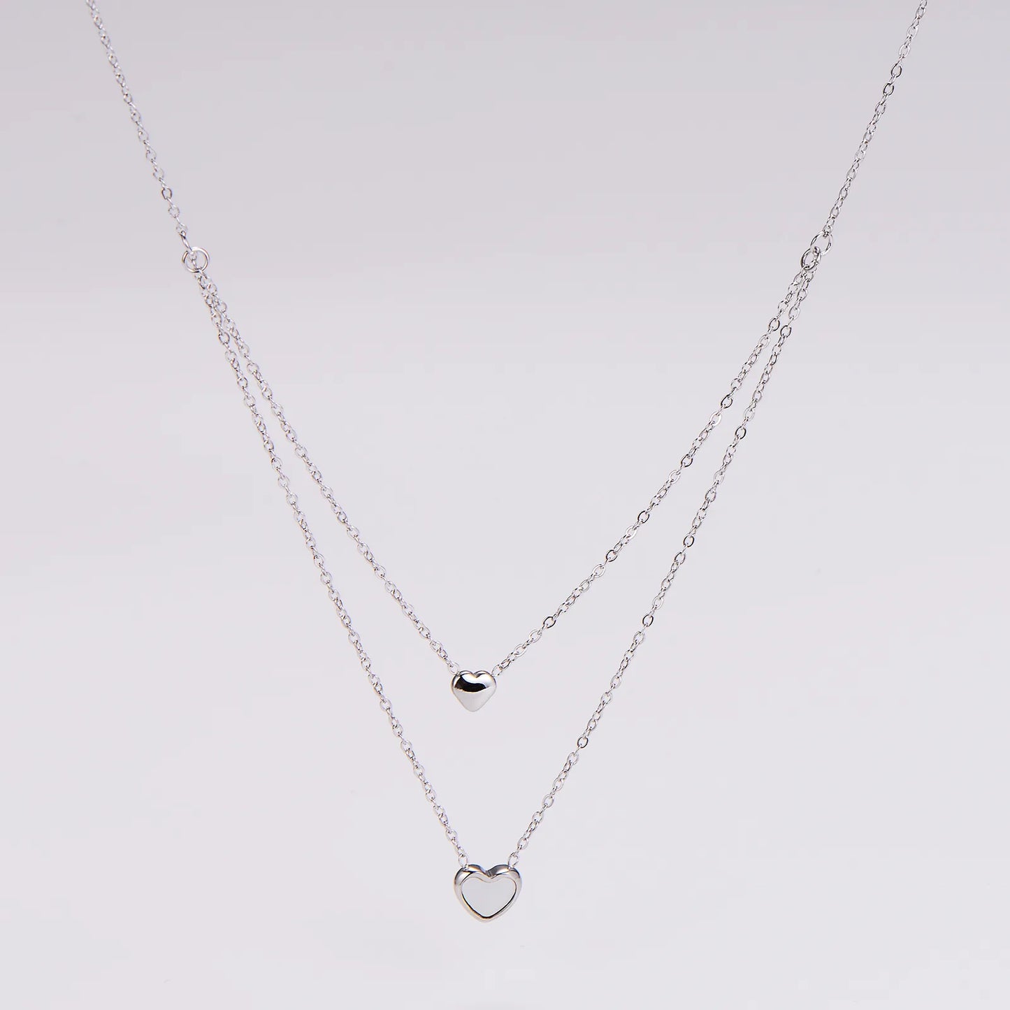 Layer doble de corazones plateado