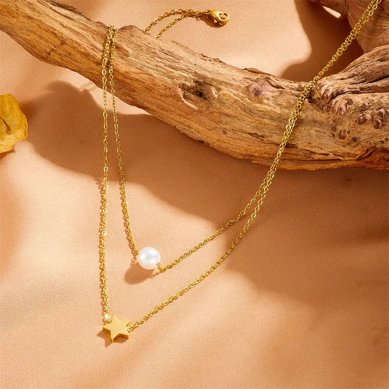 LAYER DOBLE DE PERLA CON ESTRELLA DORADO