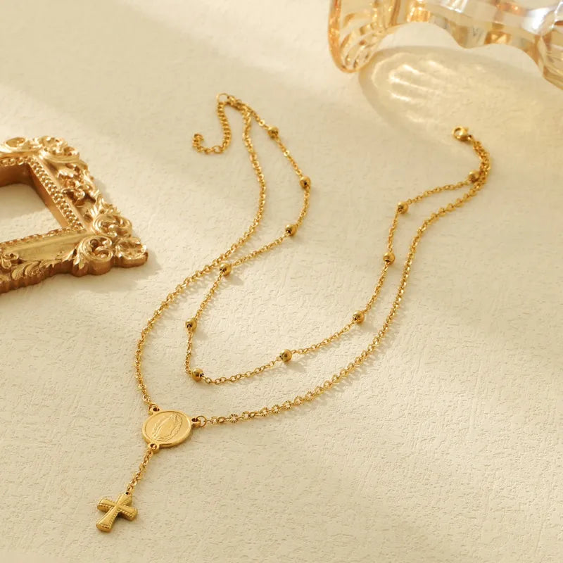 LAYER DOBLE DE CRUZ CON DIJE DORADO