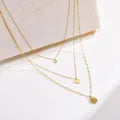 LAYER TRIPLE DE FLOR CON ZIRCON DORADO