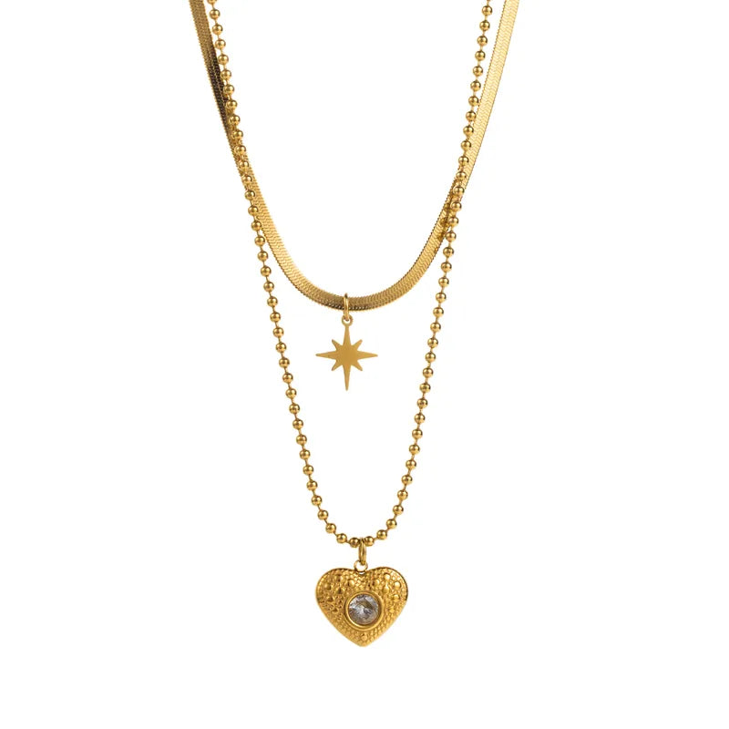 LAYER DOBLE DE CORAZON CON ZIRCON DENTRO DORADO
