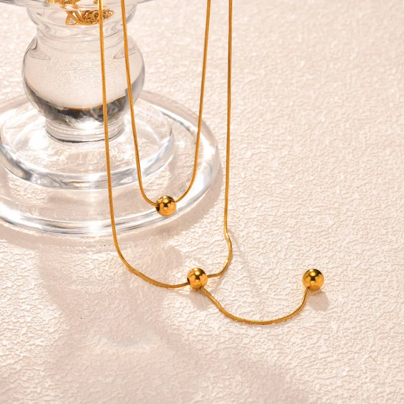 LAYER DOBLE DE CORDON CON BALINES DORADO