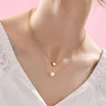 LAYER DOBLE DE CORAZON CON PERLA DORADO