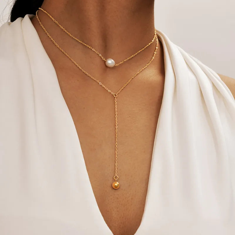 LAYER DOBLE COLGANTE DE PERLA DORADO