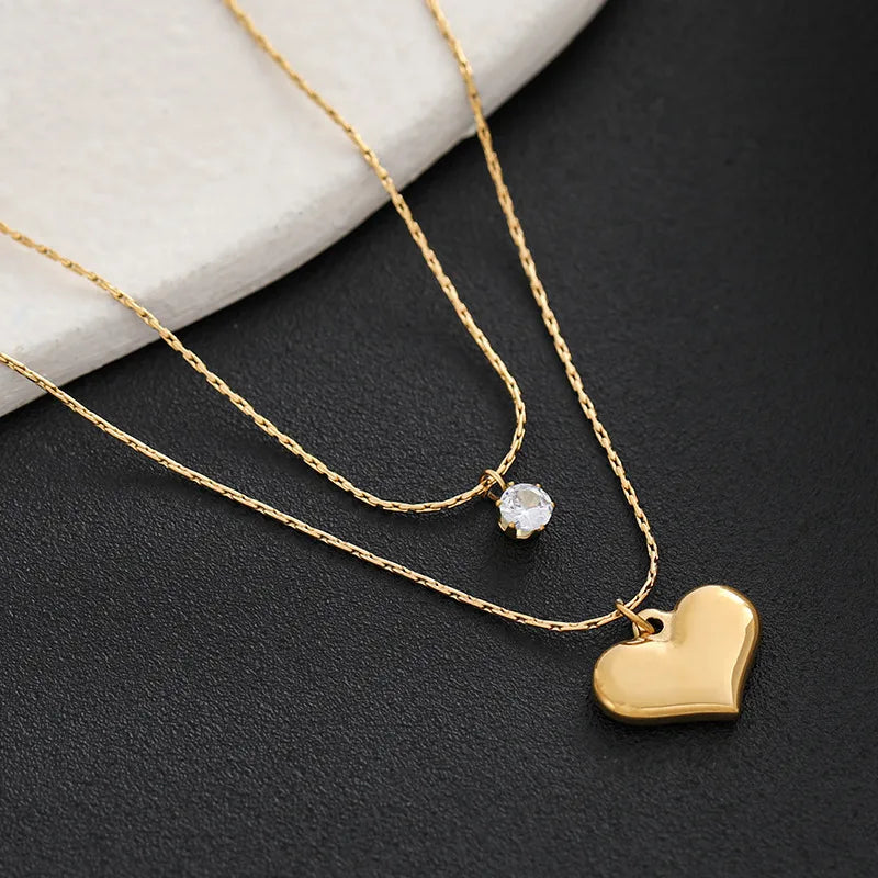 LAYER DOBLE DE CORAZON CON ZIRCON DORADO