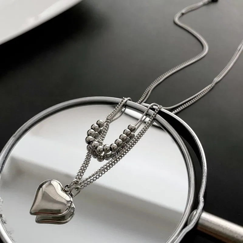 LAYER DOBLE CON PERLAS PLATEADAS Y CORAZON
