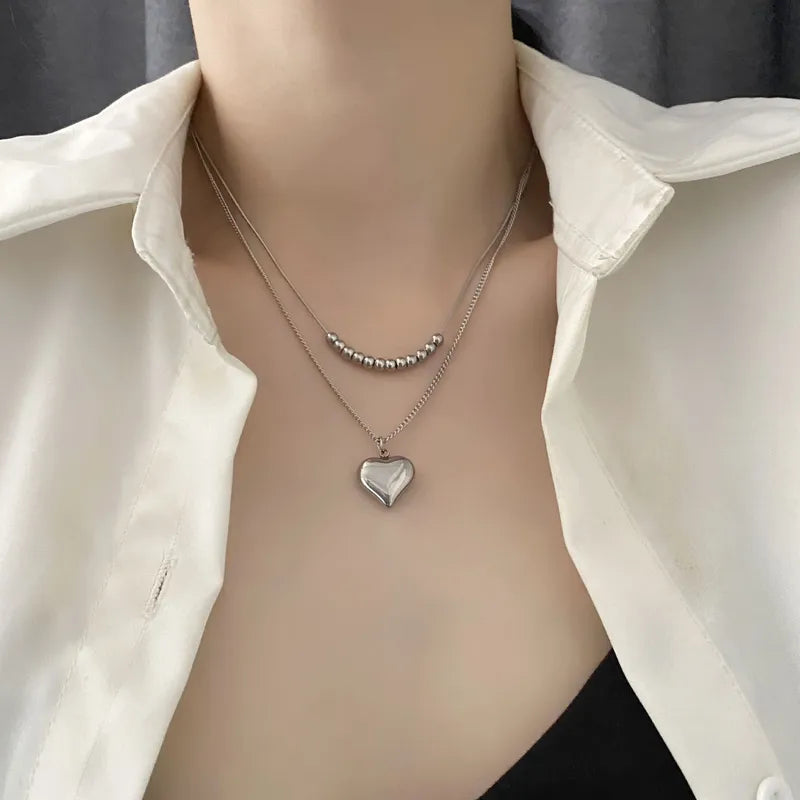 LAYER DOBLE CON PERLAS PLATEADAS Y CORAZON
