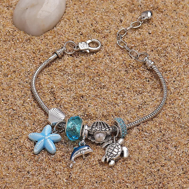 PANDORA DELFIN CELESTE PLATEADO