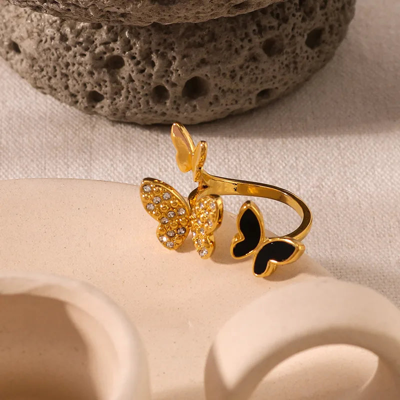 Anillo varias mariposas negra dorado