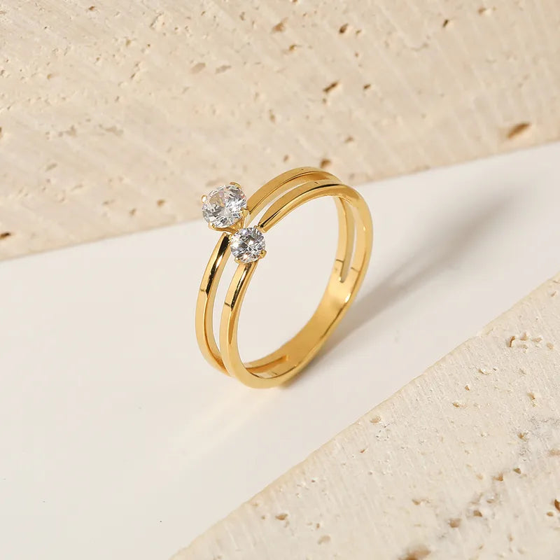 ANILLO DOBLE ZIRCON DORADO