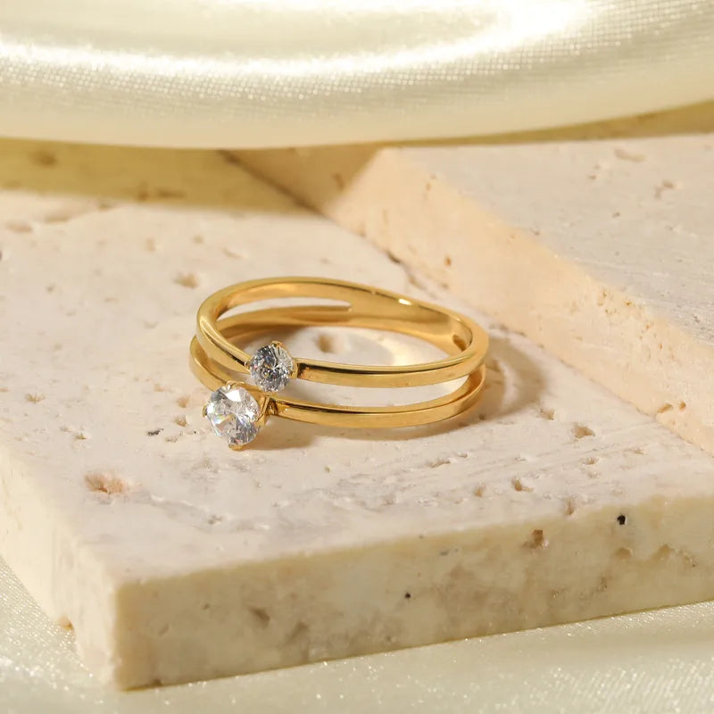 ANILLO DOBLE ZIRCON DORADO