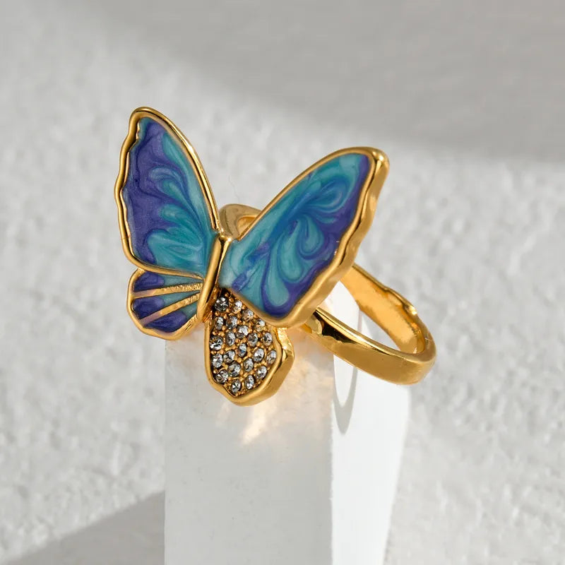 ANILLO AZUL CON MORADO MARIPOSA DORADO