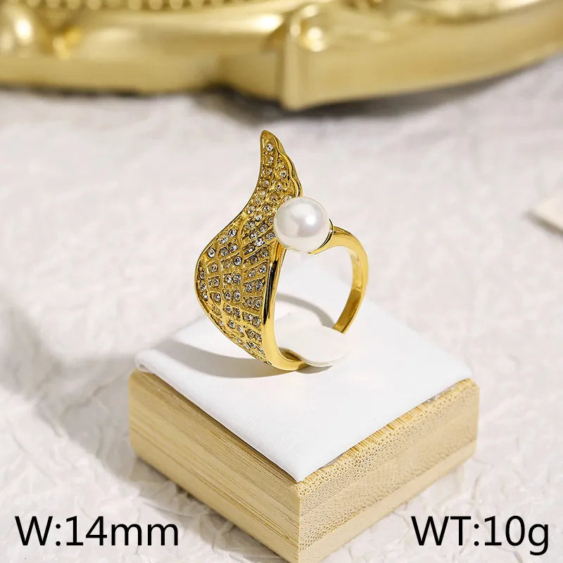 Anillo zircones con perla