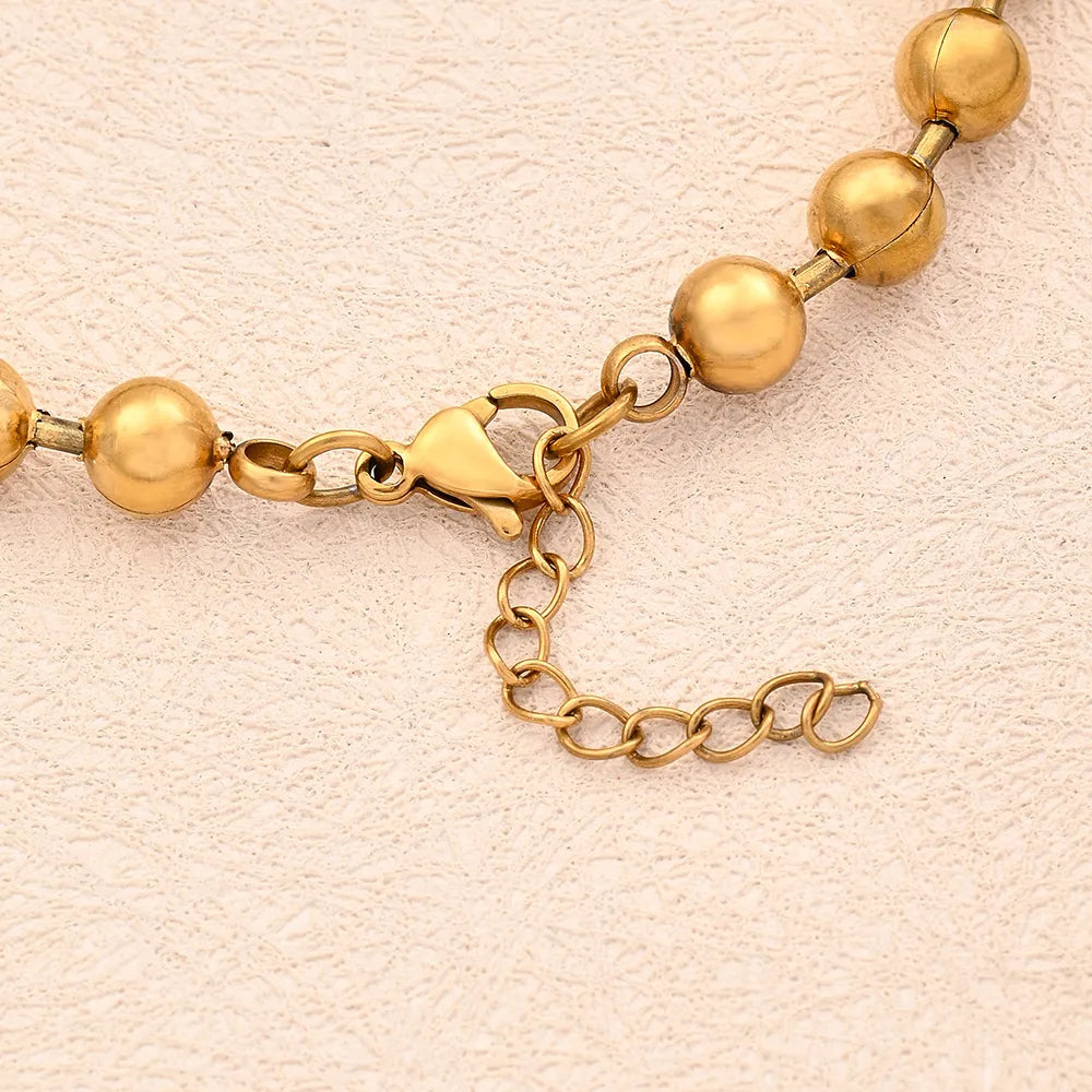 Pulsera balines dorado 10mm