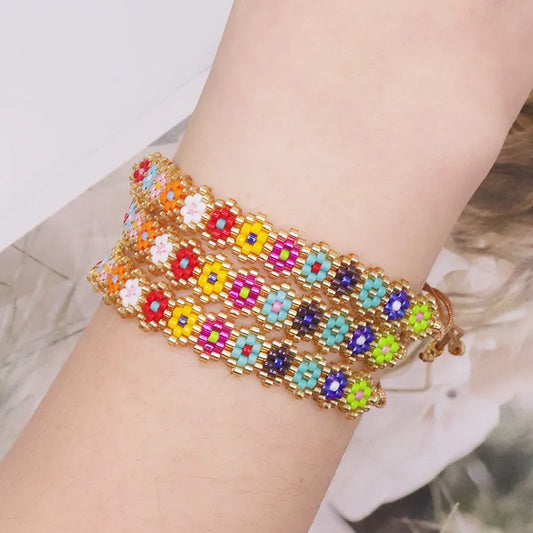 PULSERA DE FLORES HILERA MULLOS AJUSTABLE