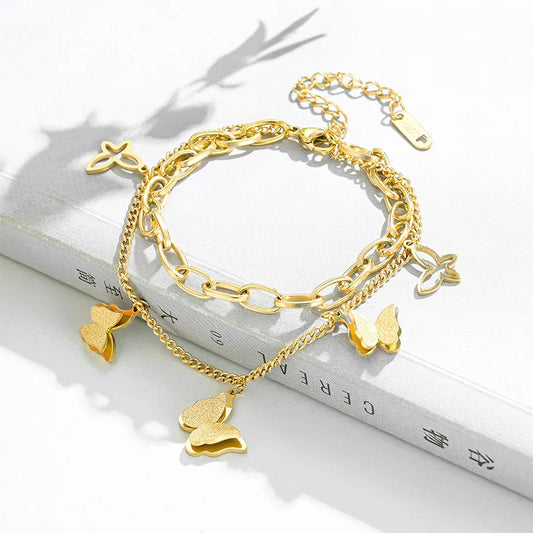 PULSERA DOBLE DE PERLAS CON MARIPOSA