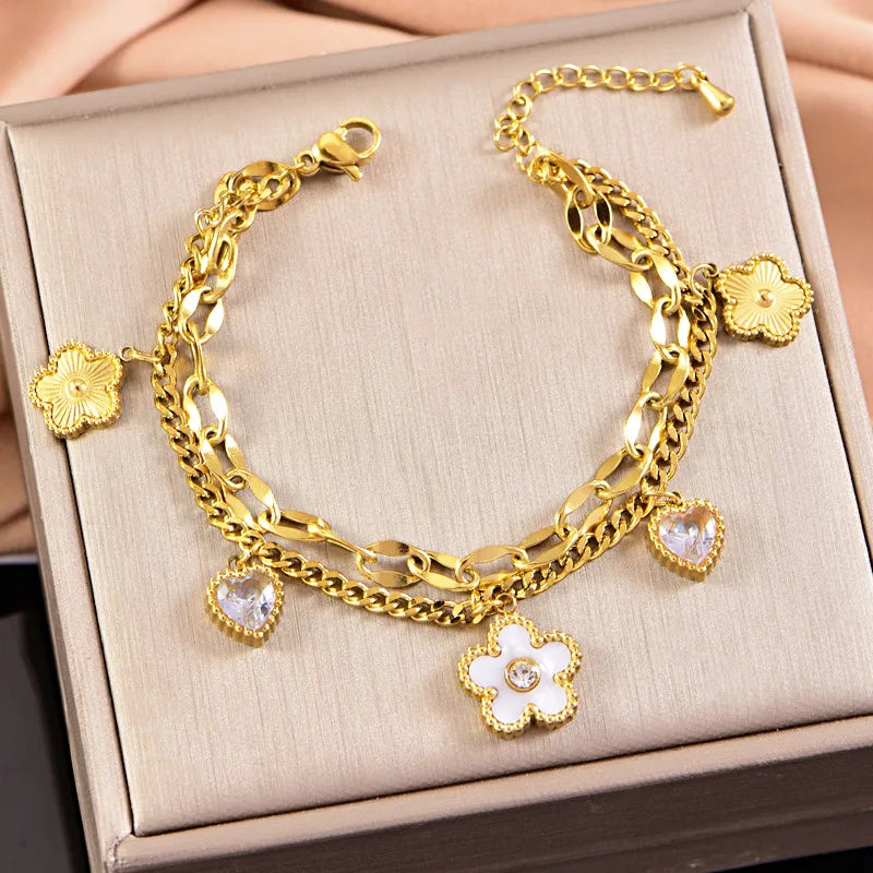 PULSERA DOBLE ESLABONES CON FLOR DORADO