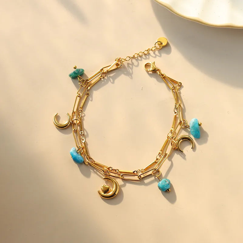 PULSERA DOBLE CON LUNA PIEDRAS TURQUESA DORADO