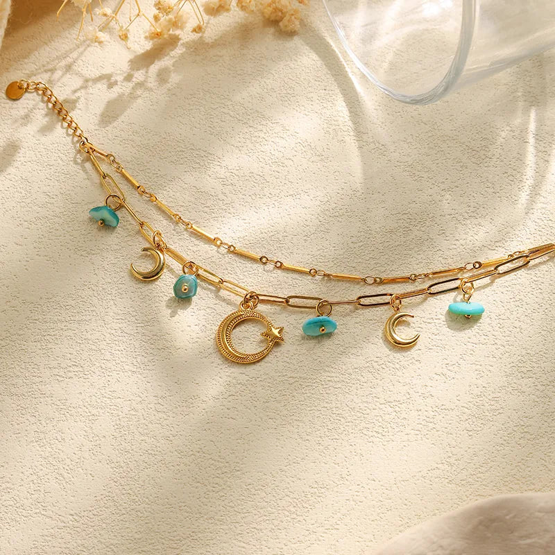 PULSERA DOBLE CON LUNA PIEDRAS TURQUESA DORADO