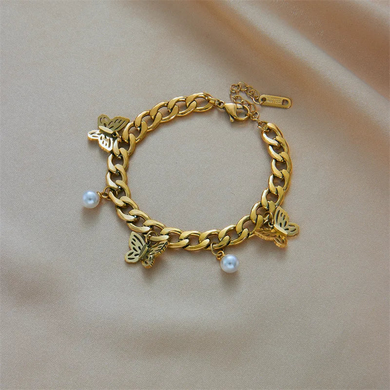 PULSERA ESLABONES ANCHOS CON MARIPOSA DORADO