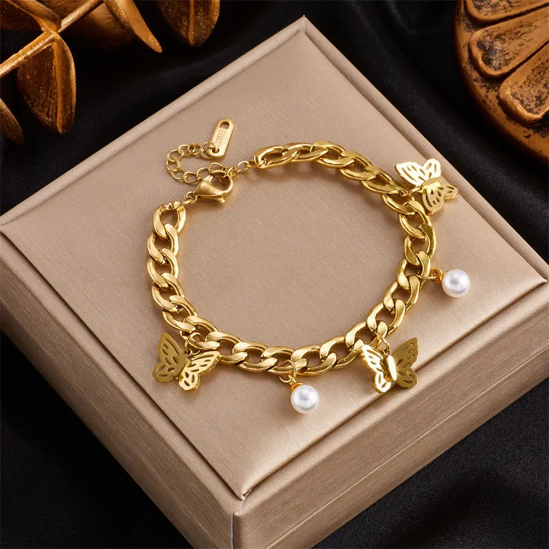 PULSERA ESLABONES ANCHOS CON MARIPOSA DORADO