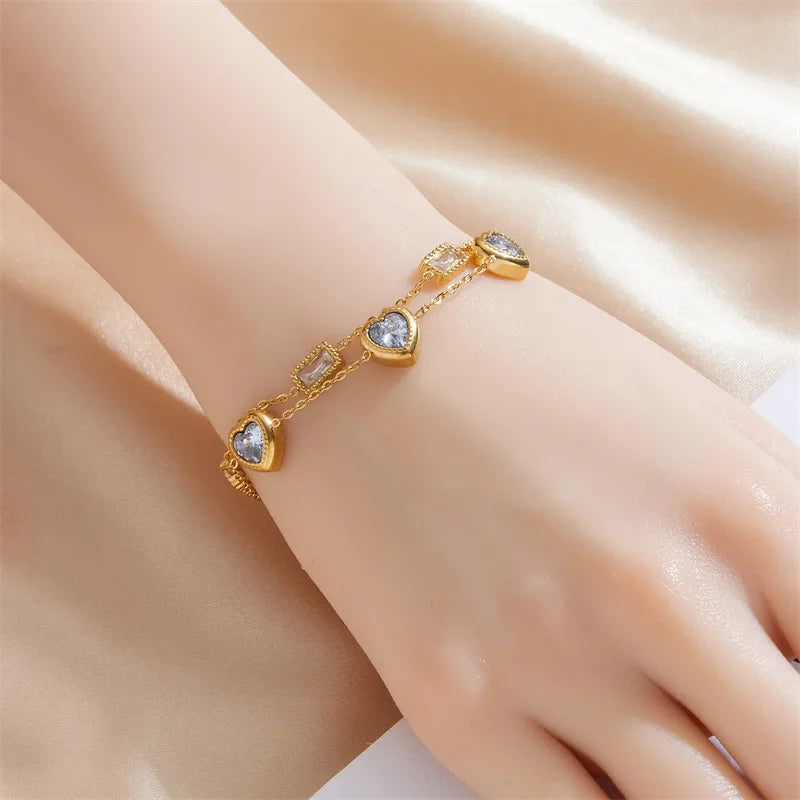 PULSERA DOBLE DE CORAZONES CON ZIRCONES DORADO