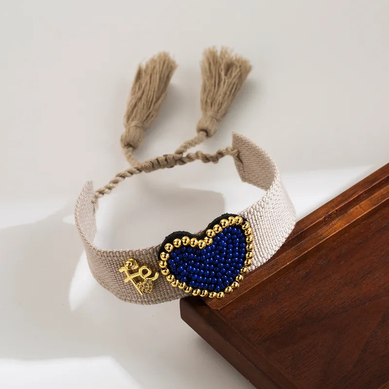 PULSERA DE CORAZON AZUL CON MULLOS AJUSTABLE