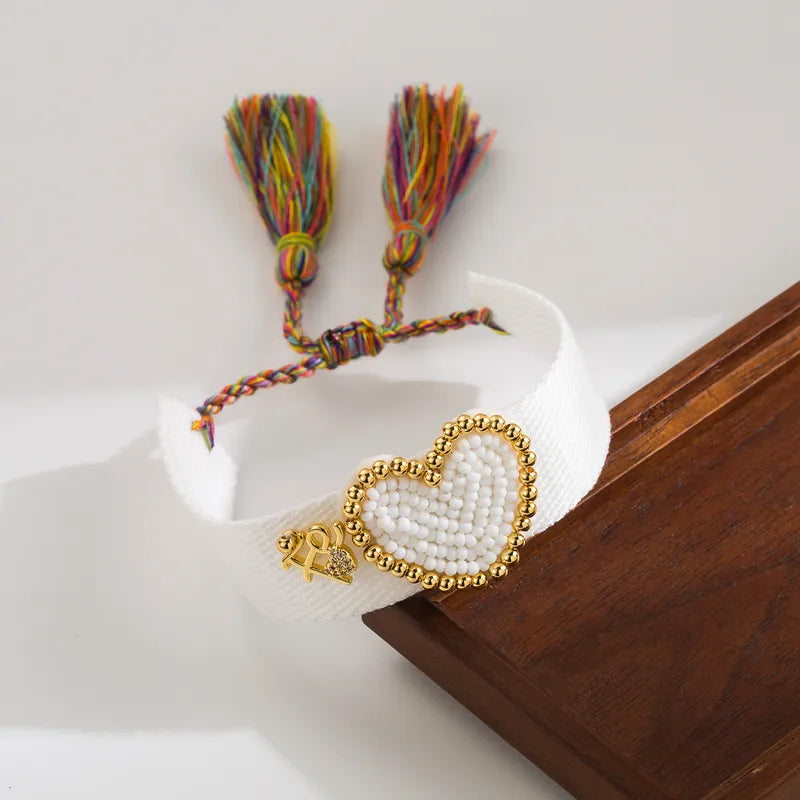 PULSERA CORAZON CON MULLOS BLANCOS AJUSTABLE