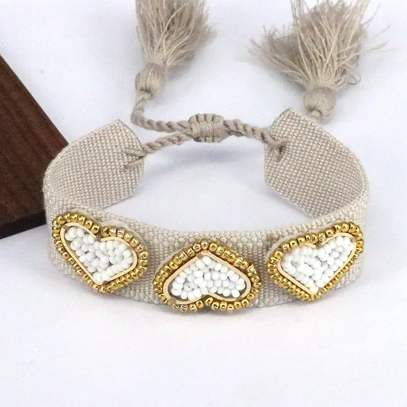 PULSERA 3 CORZONES MULLOS BLANCOS BEIGE