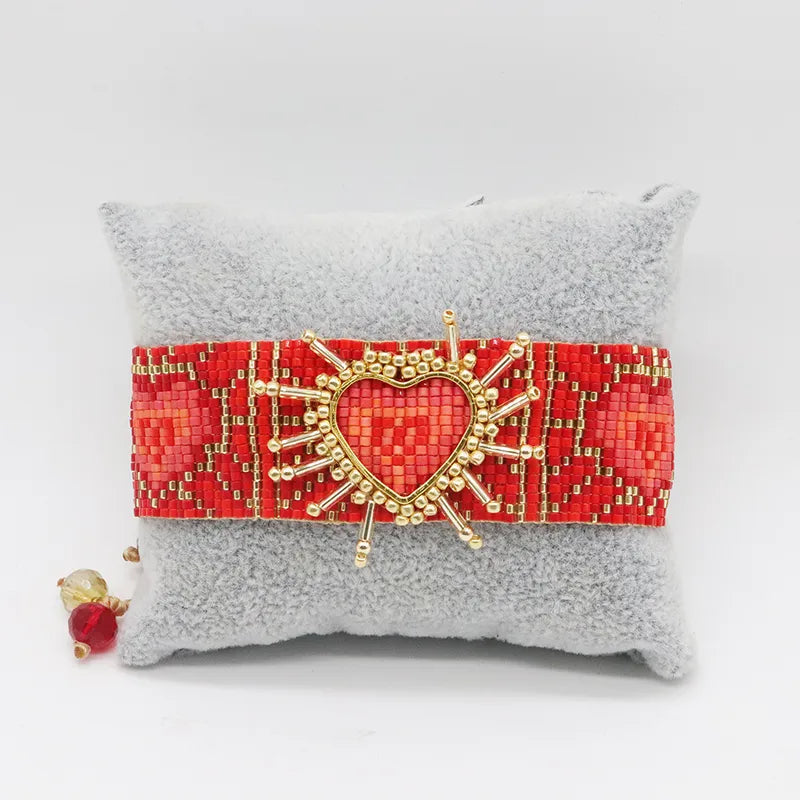PULSERA DE MULLOS ROJO TEJIDA DORADO