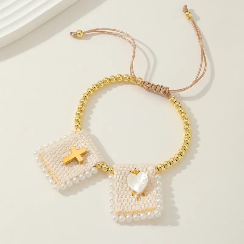 PULSERA BALINES CON CURZ,CORAZON DORADO