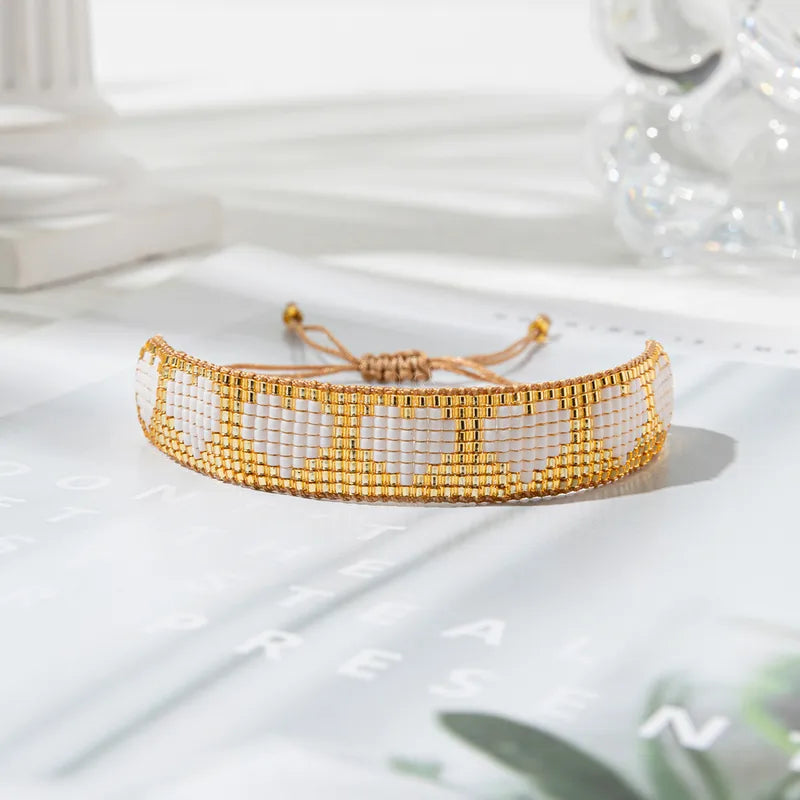 PULSERA CORAZONES TEJIDOS DORADO
