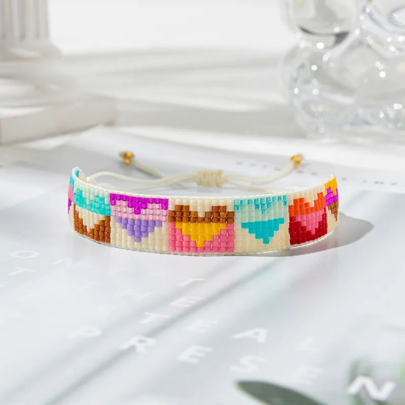 PULSERA MULTICOLOR CORAZONES TEJIDOS MULLOS