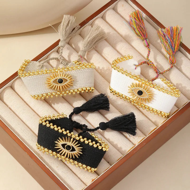 PULSERA OJO TURCO TEJIDO NEGRO DORADO