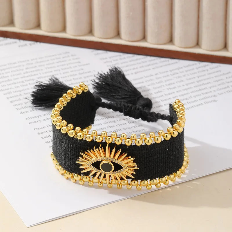 PULSERA OJO TURCO TEJIDO NEGRO DORADO