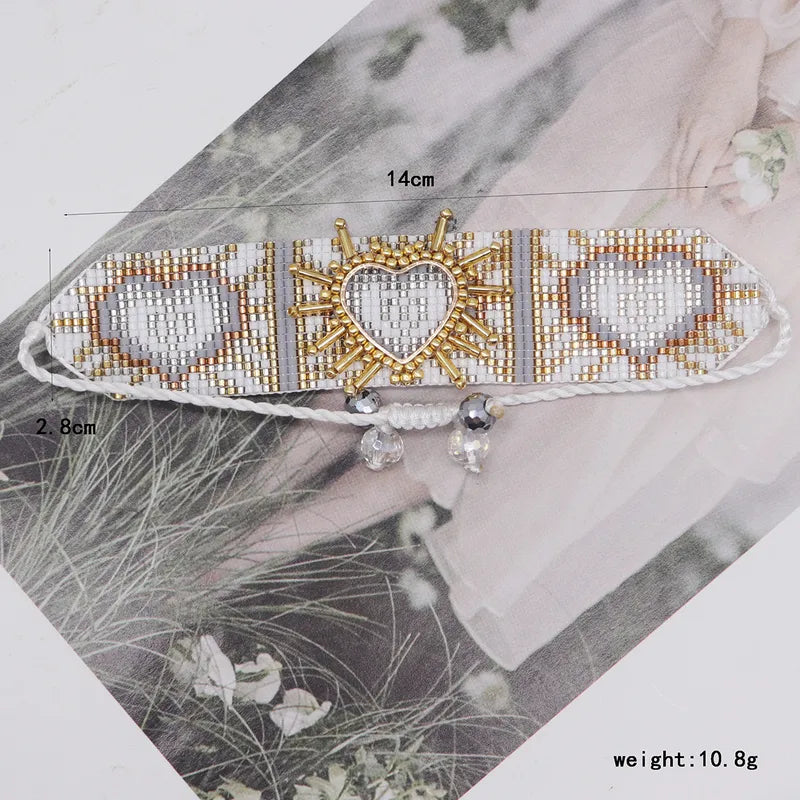 PULSERA TEJIDA OJO TURCO CON MULLOS BLANCOS-GRISES