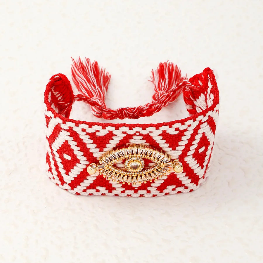 PULSERA TEJIDA CON PATRON ROJO OJO TURCO DORADO