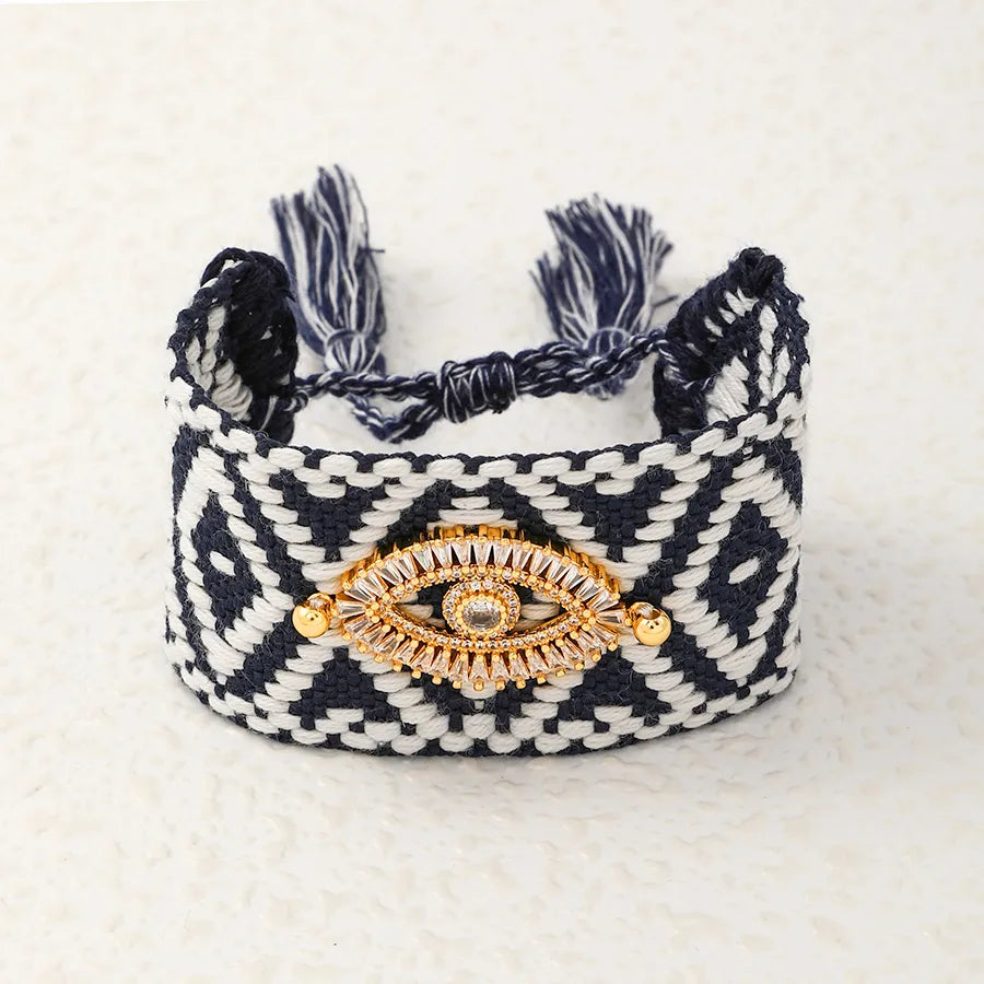 PULSERA TEJIDA CON PATRON NEGRO OJO TURCO DORADO