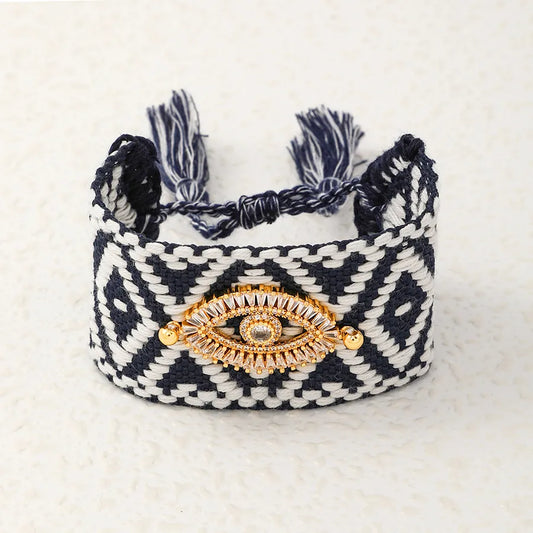 PULSERA TEJIDA CON PATRON NEGRO OJO TURCO DORADO